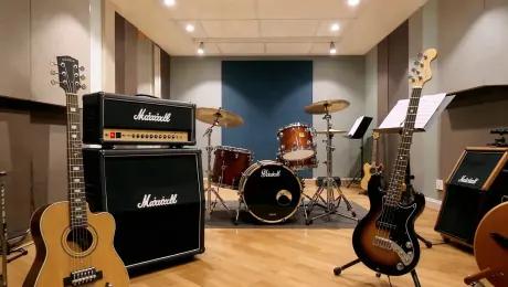 The camera enters a bright and cozy band rehearsal room—empty of people but full of instruments: guitars, amps, bass, drums. The scene is rich in realistic detail. [Slow pan] as the drumhead subtly quivers in the silence.