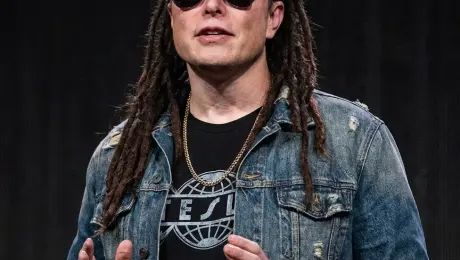 Transform the person in the picture into a dreadlocked hairstyle, and dress them in sunglasses and clothing to become an American hip-hop artist.