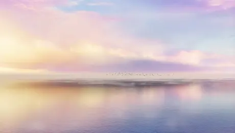 Dreamlike cinematic sequence: gentle camera drift over a calm lake, surface reflecting pastel-colored clouds, soft focus edges; a flock of birds glides across the horizon, golden light breaking through mist, painterly textures blended with photorealism, ethereal atmosphere.