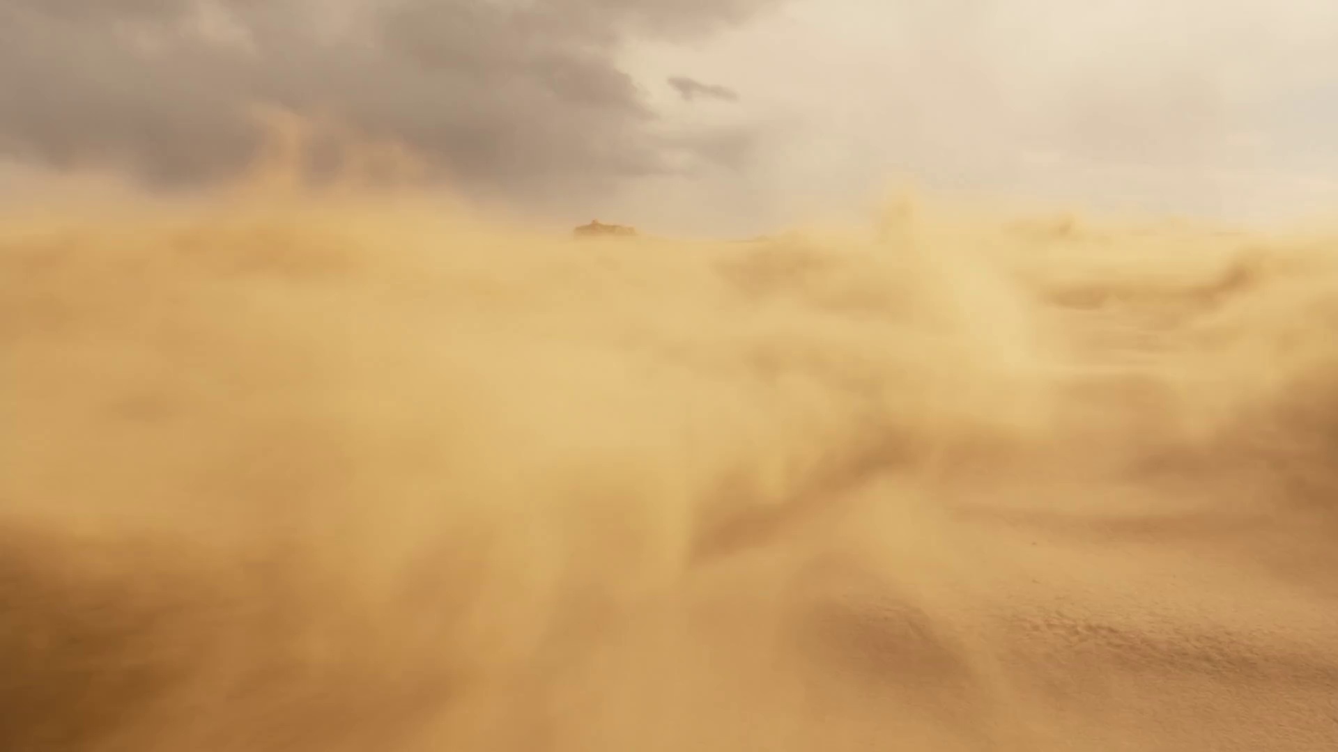 An overhead, cinematic aerial shot sweeps across a vast desert, where endless yellow sandstorms swirl under a raging sky. The wind howls through the barren expanse, filling the frame with an oppressive yet frenzied atmosphere. As a sudden gust surges past the lens, the camera transitions seamlessly, pulling focus onto a lone, veil-covered teenage boy. His figure emerges from the storm, shrouded in mystery, as grains of sand lash across the screen.