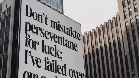 Replace the exterior wall text with “Don’t mistake perseverance for luck; I’ve failed over and over until I won.”
