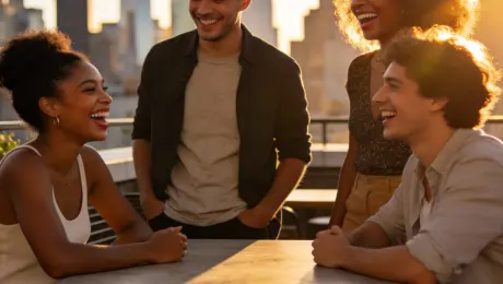 Golden hour rooftop gathering, 16:9, 4K.
A group of four friends with diverse skin tones sit and stand around a low table on a city rooftop café, laughing and talking, no visible brands or logos. Use the provided reference portraits (if any) to keep their faces, hairstyles and outfits consistent.
Warm sunlight from the side, soft rim light on hair and shoulders, blurred city skyline in the background, string lights glowing above.
Casual modern outfits with natural wrinkles and fabric texture, realistic skin details, subtle makeup.
Cinematic lifestyle photography, shallow depth of field, slight film grain, clean composition, publish-ready campaign image.