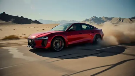 A sports car driving fast on a desert highway, kicking up a massive trail of dust, camera tracking the car from behind, harsh sunlight, motion blur, sense of speed, cinematic action shot, high contrast.