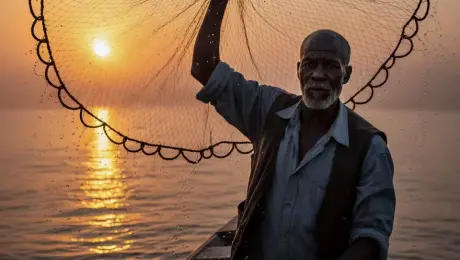 Weathered elderly fisherman standing on a traditional wooden boat, slowly lifting a large circular fishing net with glistening water droplets cascading down in slow motion. The subject's facial muscles subtly shift as he gazes toward the horizon, his grey beard catching the golden light. Low-angle slow zoom in toward the fisherman's face, combined with a subtle handheld camera shake to simulate the natural sway of the water. Epic sunset atmosphere with golden hour light creating a shimmering reflection on the undulating waves, volumetric sunbeams piercing through the fine mesh of the net. 4k, 60fps, slow motion, highly detailed, realistic texture, cinematic color grading, photorealistic.