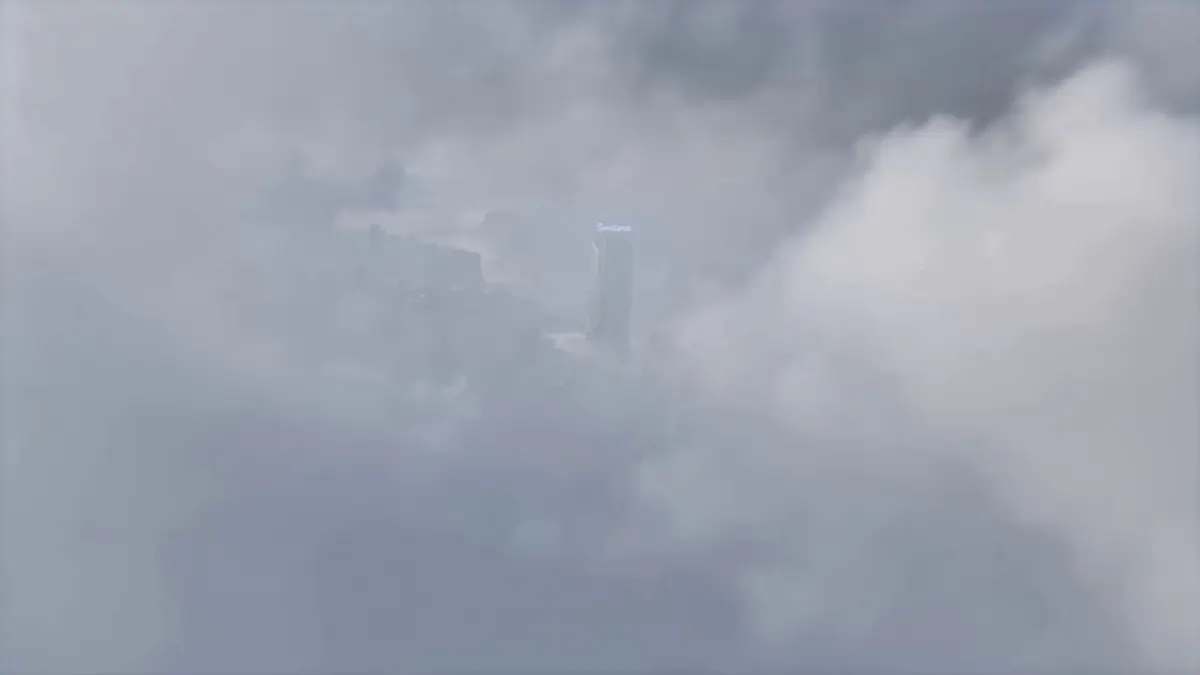 Referencing the camera movement in the video, use the image as the first frame to create a concept video of a tech campus. Take the tall building in the image as the visual center, also using a first-person俯冲 (diving/descending) perspective to showcase the technological feel of the campus in the image.